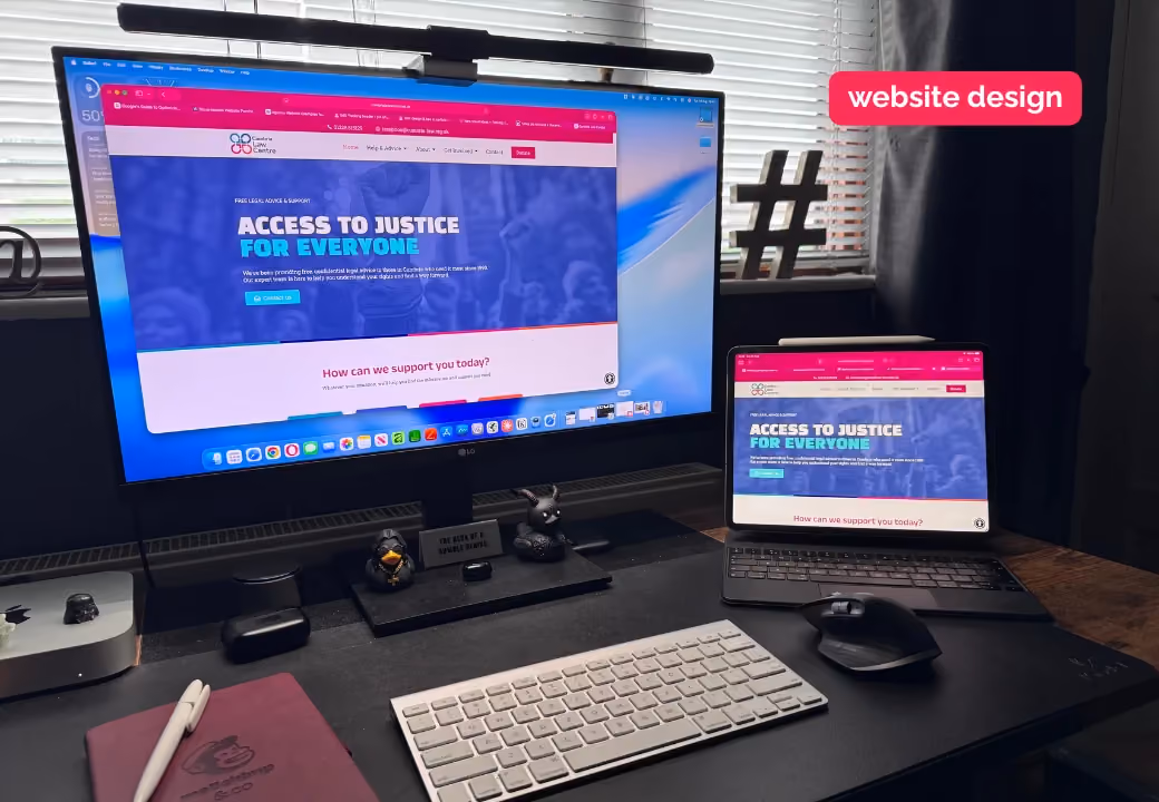 web design carlisle - desk at fecking creative with clients website open on screen and iPad